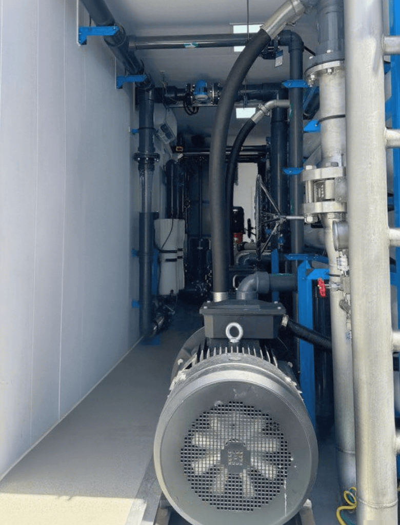 High-pressure pump and motor inside Globaluf's containerized SWRO system