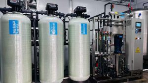 Panoramic view of a Globaluf 3 cubic meters per hour (3m³/h) ultrapure water treatment plant, fully installed and operational at an industrial client site, showcasing complete pre-treatment, RO, and advanced post-treatment modules for high-purity applications.